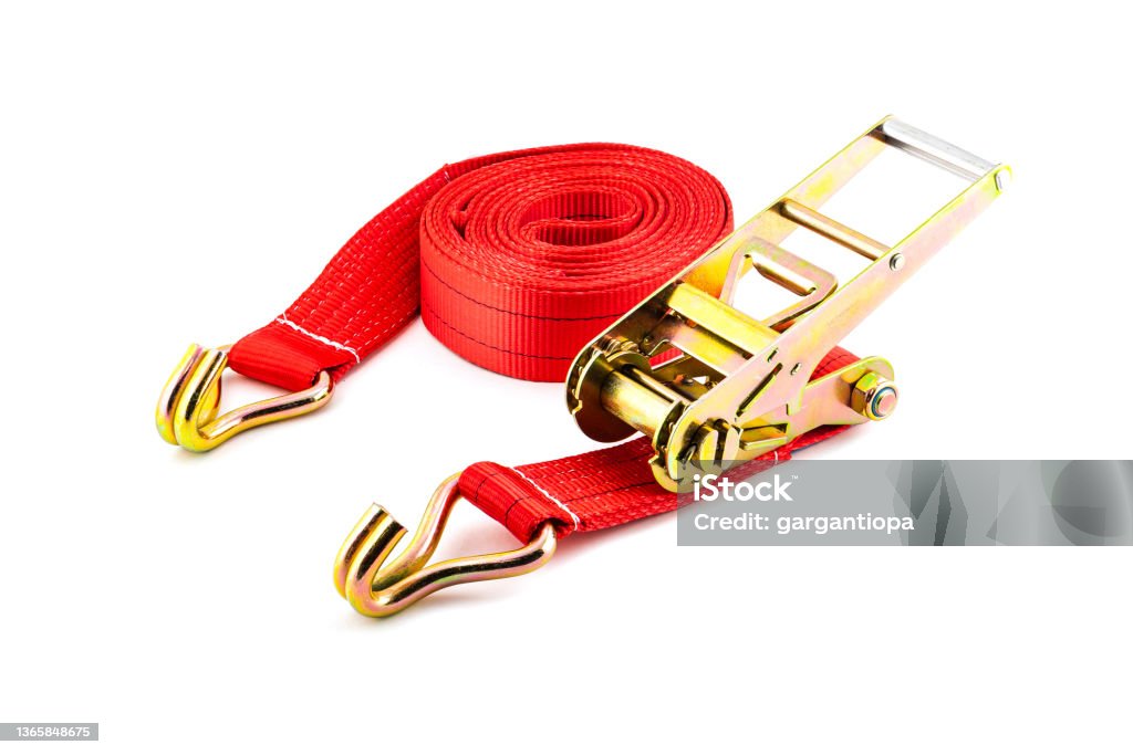 Trailer strop or strap in orange nylon and metal tie isolated over white background. Ratchet straps for cargo load control. Cargo restraint strap Strap Stock Photo