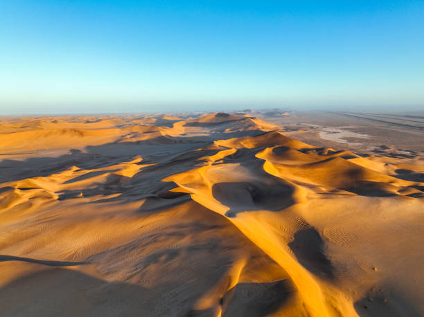 istock Aerial view desert dune landscape at sunrise 1365849968