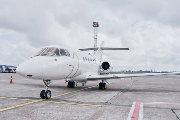 istock Front view. Turboprop aircraft parked on the runway at daytime 1365850681