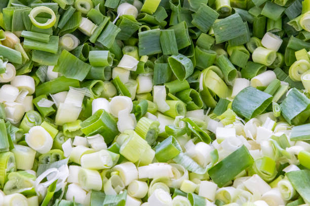 istock Healthy Scallion. Many chopped green onions. Fresh spring onions. 1365851379