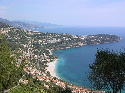 Wonderful French Riviera panorama on Mediterranean Sea in Roquebrune Cap Martin near Monaco with coast, beach, rocks and pine trees.