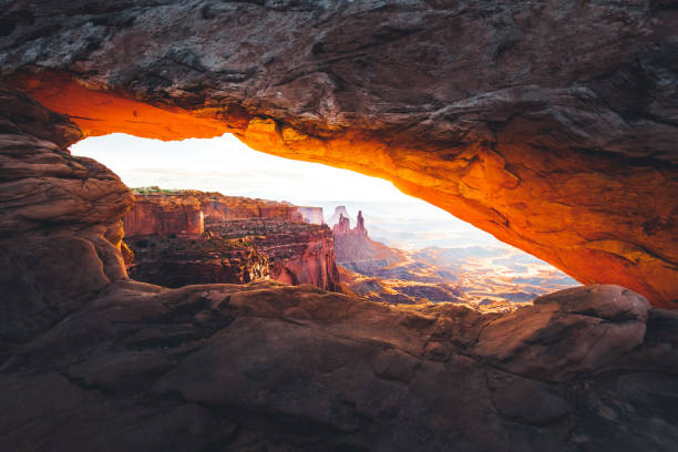 Mesa Arch Sunrise The sunrise at the Mesa Arch in the Canyonlands National Park makes the arch glow, Utah, USA. zion stock pictures, royalty-free photos & images