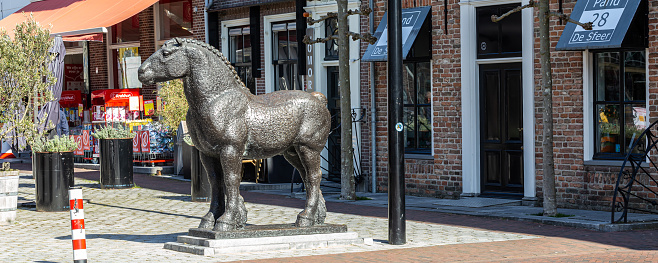 Vianen, The Netherlands - March 29: Sculpture of horse in front of the city hall Vianen in remembrance of the horse market Utrecht in The Netherlands