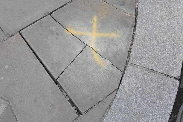 Painted pavement in a parking lot of the words \