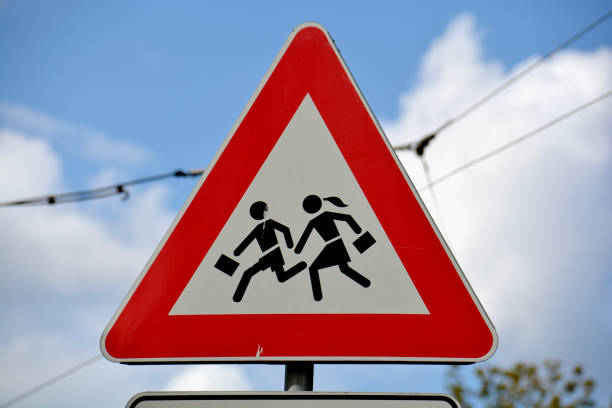 istock European school road sign on sky background 1365855694