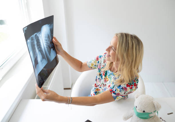 istock Pediatrician views X-ray image in her practice 1365855725