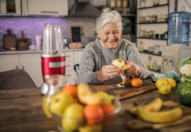 istock little girl making a fresh juice with his family 1365856496