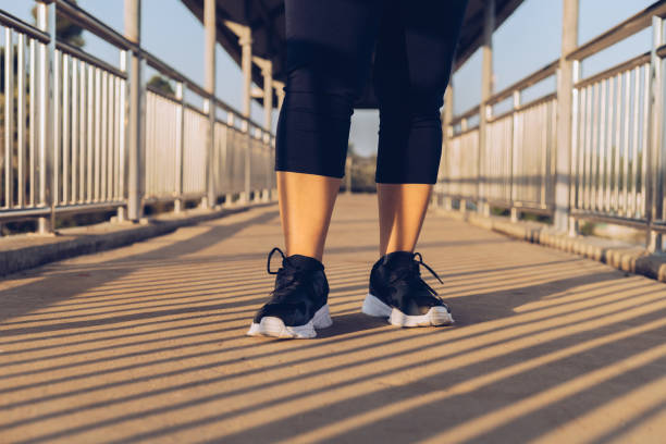 istock woman walking exercise on the overpass 1365856756