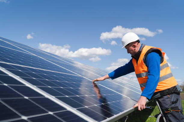 istock Solar power plant engineer makes a visual inspection of solar panels 1365857058