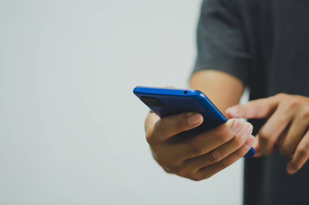 istock man using mobile phone social media and modern technology or online shopping for financial transactions.Copy space 1365858421