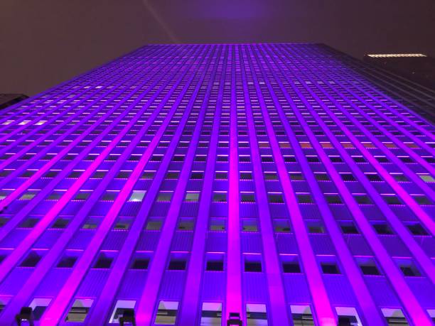 Photo of one of the buildings on Prudential Plaza at night, glowing in Purple. Chicago, Illinois, USA.