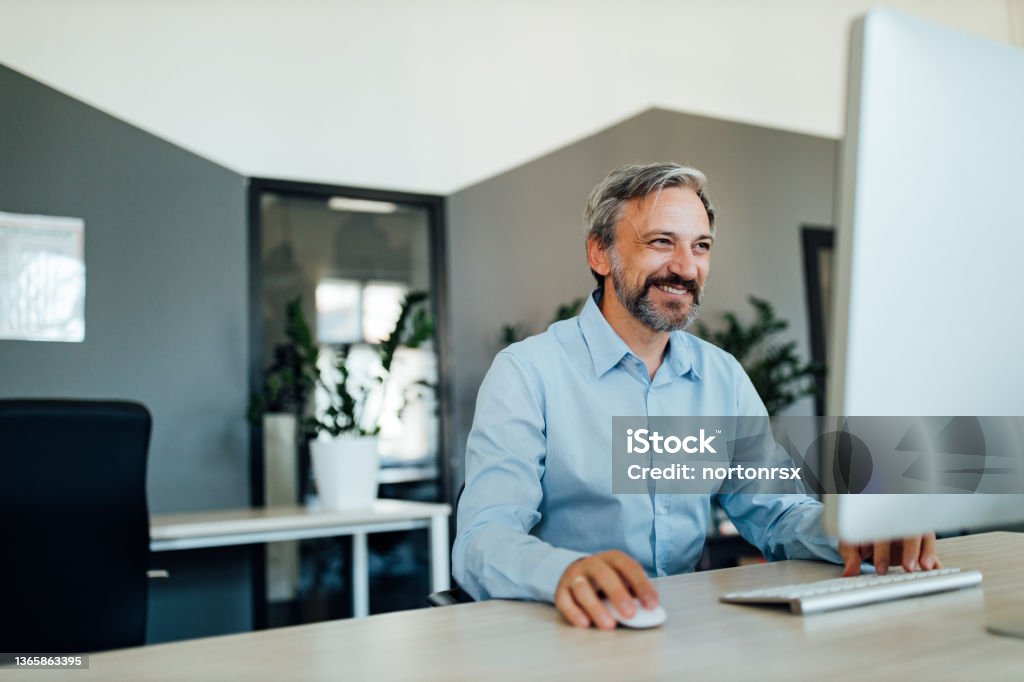 Happy Man Using Computer Happy Man Using His Computer Stock Photo - Download Image Now - Men ...