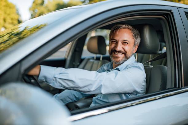 istock Man prepares to drive a car. 1365863416