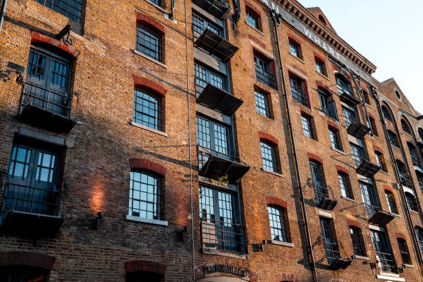 An aerial photograph of the windows of a  Victorian Mills in Ancoats in downtown Manchester, Northwest England. This mill was built in an era which was once part of the Industrial Revolution, which was led by the great city of Manchester, particularly Ancoats.  Many of the streets in this area reflect the rich and industrious history, such as Loom Street and Cotton Street,