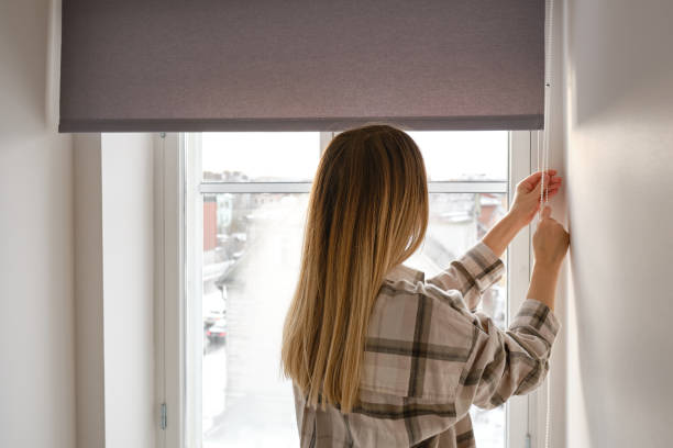 home blinds or window curtains girl opens the window in the morning. morning rituals - sunny apartment window sky imagens e fotografias de stock