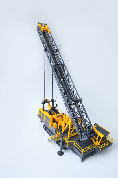 Large drill rig for drilling boreholes for explosives on a white background. Technologies of open-pit mining of minerals. The layout of a drilling rig.