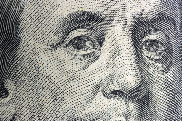 istock Benjamin Franklin portrait from hundred dollar bill, macro 1365867904