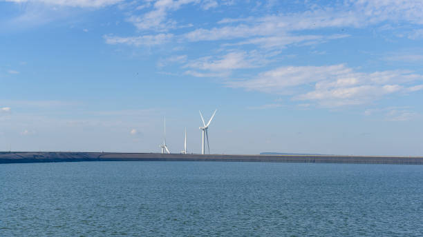 istock background of wind turbines , clean energy concept 1365868368