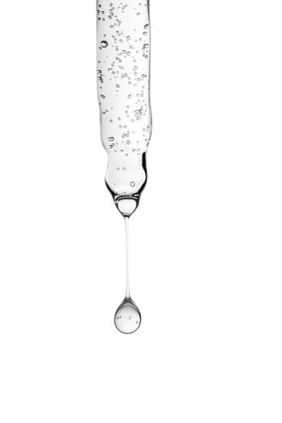 A close-up shot of half an apple being dropped into water.