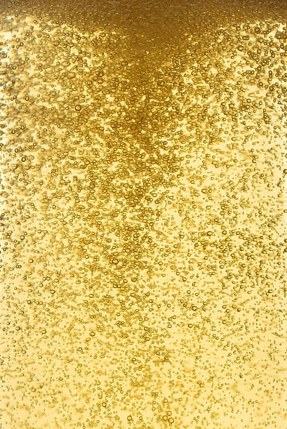 istock The texture of beer or lemonade with bubbles in close-up. 1365868906