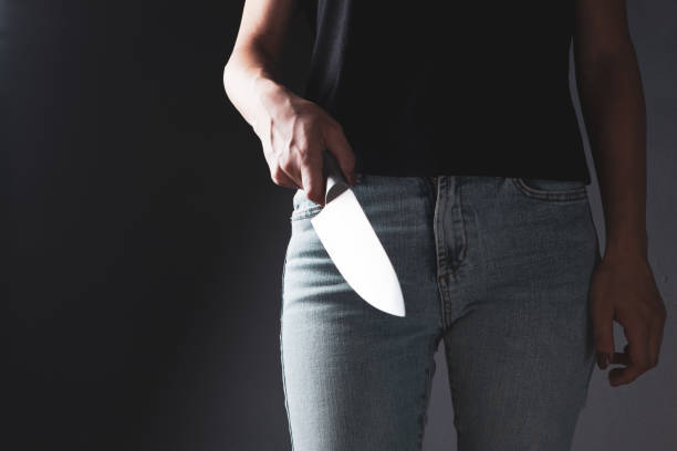 woman attacks with kitchen knife woman attacks with kitchen knife knife crime photos stock pictures, royalty-free photos & images