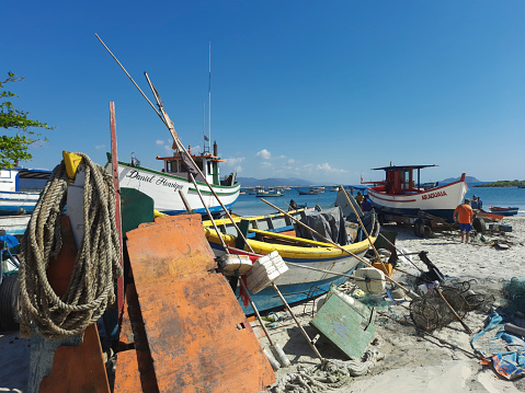 Florianópolis, SC, Brazil - December 01, 2021: Fishing boats parked at Armação beach in the south of the island of Santa Catarina