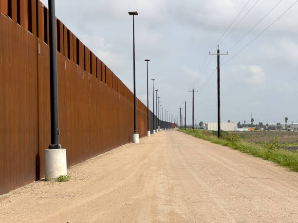 istock US-Mexico border. Border wall.Walls and security roads. 1365872997