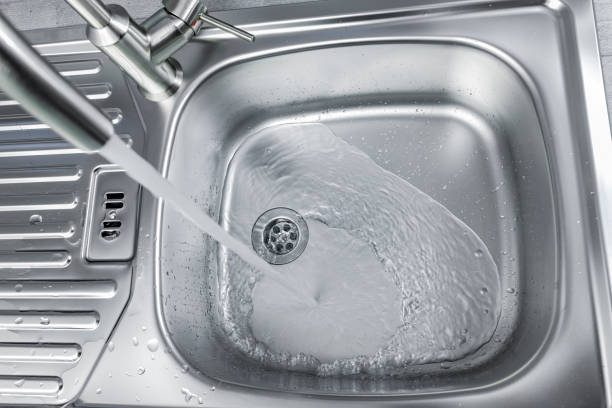 istock Water flows from a faucet into a sink 1365874377