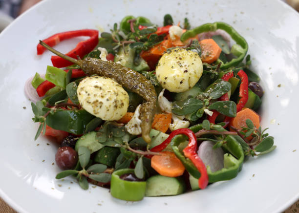 istock Greek salad with cheese. Typical delicious greek style lunch 1365875779