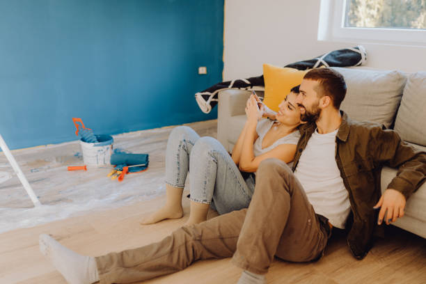 istock Young couple doing on hers apartment repair together themselves 1365876332
