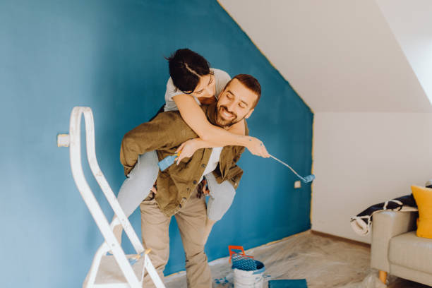 istock Young couple doing on hers apartment repair together themselves 1365876432