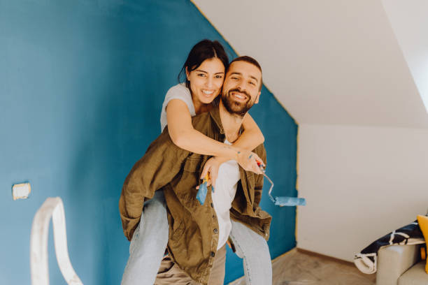istock Young couple doing on hers apartment repair together themselves 1365876441