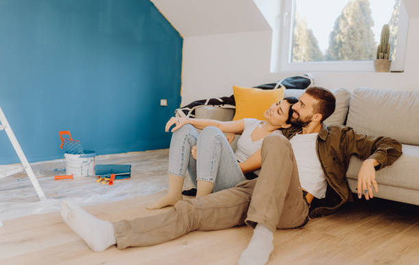 istock Young couple doing on hers apartment repair together themselves 1365877006