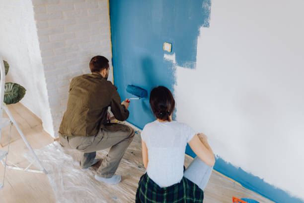 istock Young couple doing on hers apartment repair together themselves 1365877029