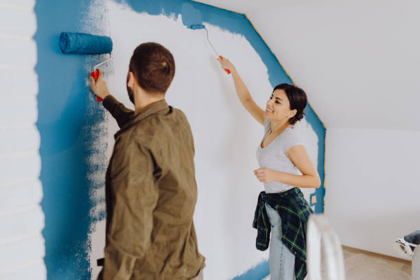 istock Young couple doing on hers apartment repair together themselves 1365877607