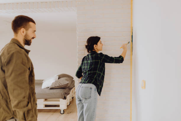 istock Young couple doing on hers apartment repair together themselves 1365877821