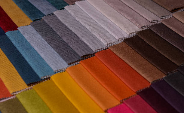 istock Samples of furniture fabrics.Multicolor fabric texture background. 1365878105
