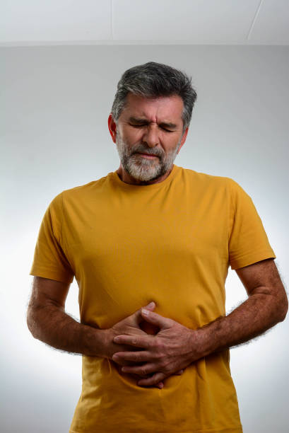 istock Mature bearded man having a stomachache. 1365879347