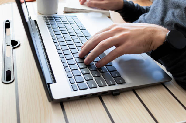 istock Man working on laptop at home 1365885156