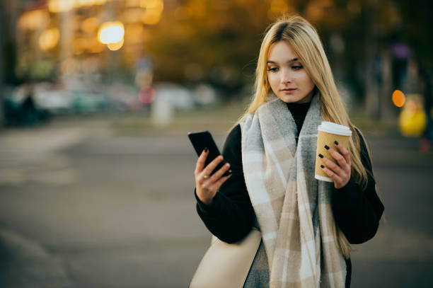 istock Young woman waiting at a bus stop 1365885303