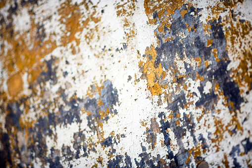 Peeling paint on a rusty old metal door