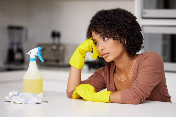 istock Shot of a woman looking unhappy while doing housework 1365886946