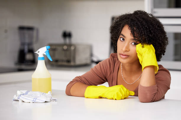 istock Shot of a woman looking unhappy while doing housework 1365886948