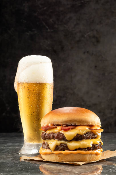 hamburger with beer on stone table - beer hamburger american culture beef imagens e fotografias de stock