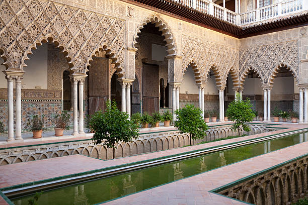 Very detailed Patio de las Doncellas, Real Alcazar, Seville One of the most beautiful landmarks in Real Alcazar Palace in Seville, Spain alcazar seville stock pictures, royalty-free photos & images