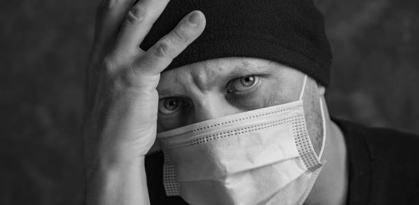 istock A man in a protective mask against coronavirus, close-up. 1365890154