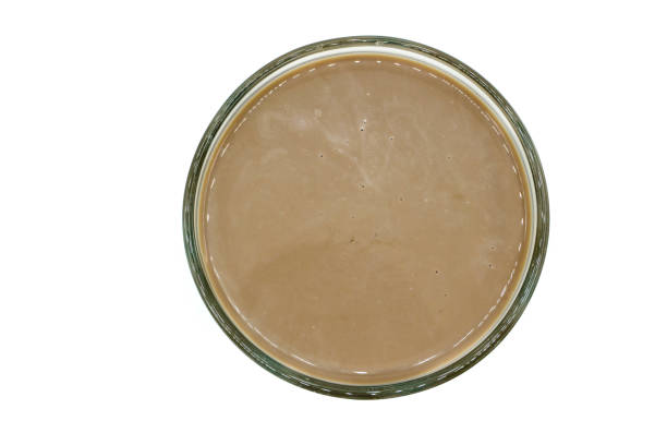 istock Chocolate milk in glass isolated top view 1365890415