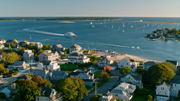 Yacht in Hyannis Harbor on Cape Cod - Aerial Aerial shot of Hyannis, the "Capital" of Cape Cod on a Fall evening.
Authorization was obtained from the FAA for this operation in restricted airspace. hyannis port stock pictures, royalty-free photos & images