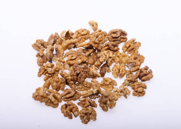 istock Shelled Walnuts Pile Top View Isolated On White Background 1365890841