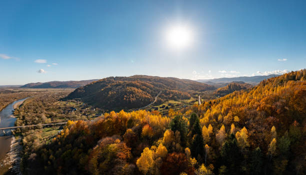 istock High mountain with red and green forests under bright sunset 1365894667